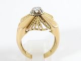 an image of a gold ring with a diamond on top of it