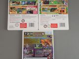 three nintendo wii games are sitting on top of a table