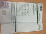 an image of a paper with a receipt on top of it