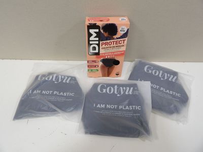 three bags of gozyl are sitting on a table next to a box of gozyl