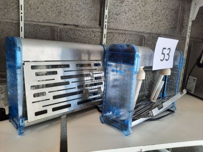 a toaster and a toaster sitting on a shelf