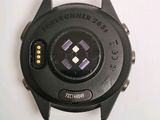 a close up of a watch on a white surface