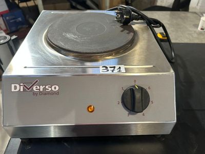 a stove top with a burner on it on a table