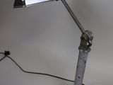 a desk lamp that is on top of a table