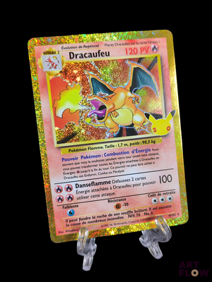a close up of a pokemon card on a stand