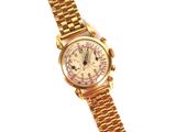 an image of a close up of a gold watch on a white background
