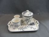 a tray with a cup and a saucer on it