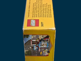 a box of legos sitting on a blue surface