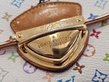 a close up of a purse with a gold buckle