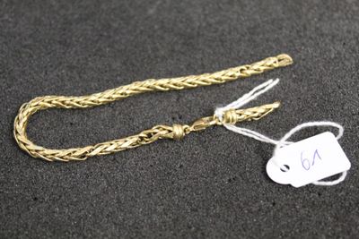 a gold chain with a tag attached to it