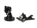 two figurines of a cat and a dog on a white surface