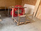 several pieces of wood are stacked on pallets in a room