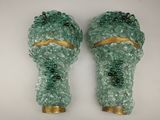 deux vases en verre vert ornés de motifs dorés
