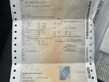 a lot of receipts sitting on the seat of a car