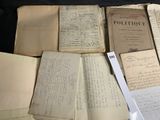 a pile of old papers sitting on top of a table