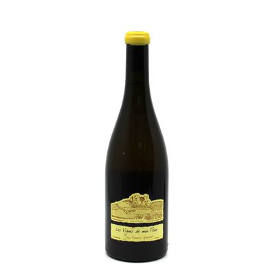 a bottle of wine sitting on top of a white table