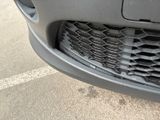 a close up of the front bumper of a car