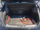 a trunk of a car with a bunch of wires in it