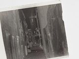 a black and white photo of a narrow alleyway