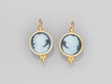 a pair of gold and blue glass cameo earrings