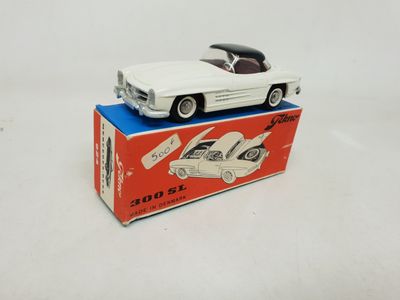 an image of a white toy car sitting on top of a box