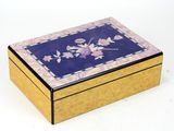 a wooden box with a floral design on it