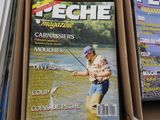 a magazine with a picture of a man fishing on the cover