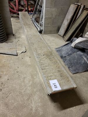a long piece of wood laying on the floor in a room