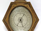 a clock that is hanging on the wall with a clock on it