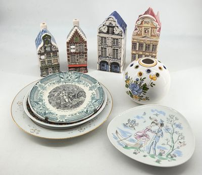 many plates and bowls that are sitting on a table
