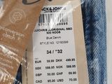 the back of a pair of blue jeans with a price tag on it