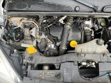 a picture of a car engine with its hood open