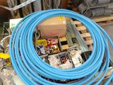 a blue hose sitting on top of a wooden pallet