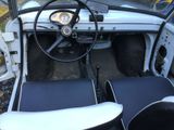 a small car with a steering wheel and a dashboard