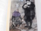 une photo d'un livre sur laquelle on voit un homme et une femme marchant dans la neige