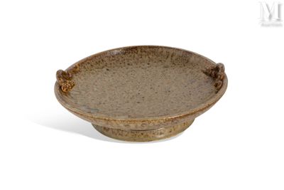 a brown bowl sitting on top of a white table
