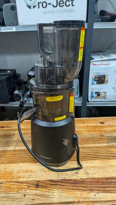 a blender that is sitting on a wooden table