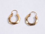 gold plated hoop earrings on a white background