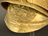 a gold helmet with an eagle on it