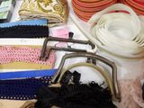 many different types of purses and accessories on the table