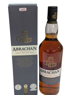 a bottle of whisky with a box on a white background