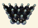 many bottles of wine that are stacked on top of each other