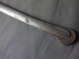 a metal handle that is on top of a piece of cloth