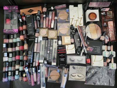 a lot of makeup and makeup products on the table