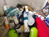 a pile of assorted items in a trash can