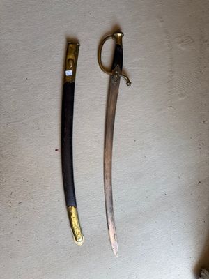 two knives that are on the table next to each other