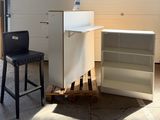an image of a kitchen with a refrigerator and a bar