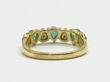 an image of a gold ring with turquoise stones on it