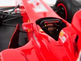 a close up of a red race car on display