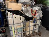 a cart full of boxes and other items in a garage